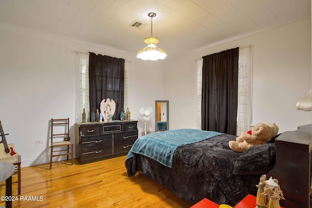 bedroom with light hardwood / wood-style flooring