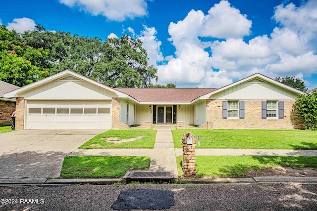 ranch-style home featuring a garage and a front lawn