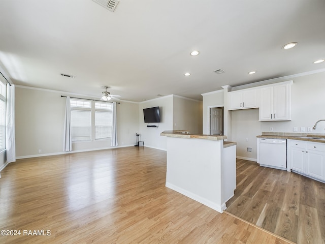 kitchen with light wood-style floors, dishwasher, white cabinets, and crown molding