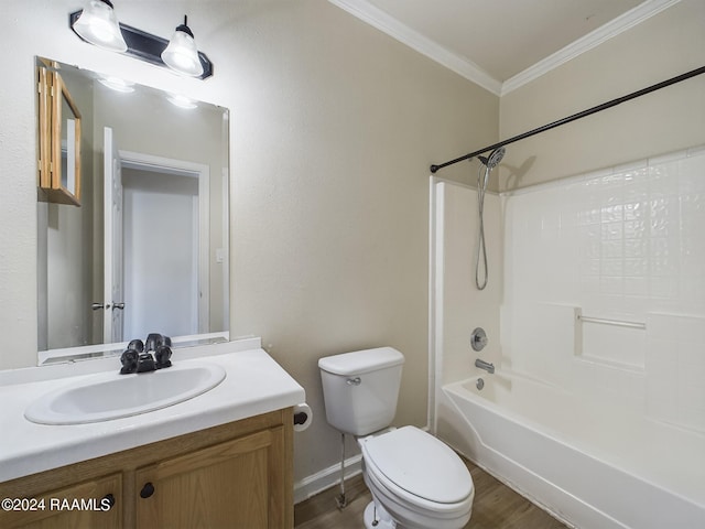 full bathroom with crown molding, shower / washtub combination, toilet, wood finished floors, and vanity