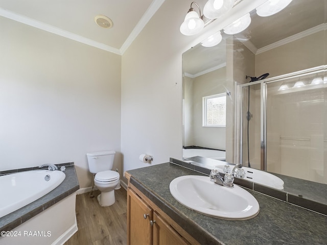 bathroom featuring vanity, wood finished floors, ornamental molding, a shower stall, and toilet