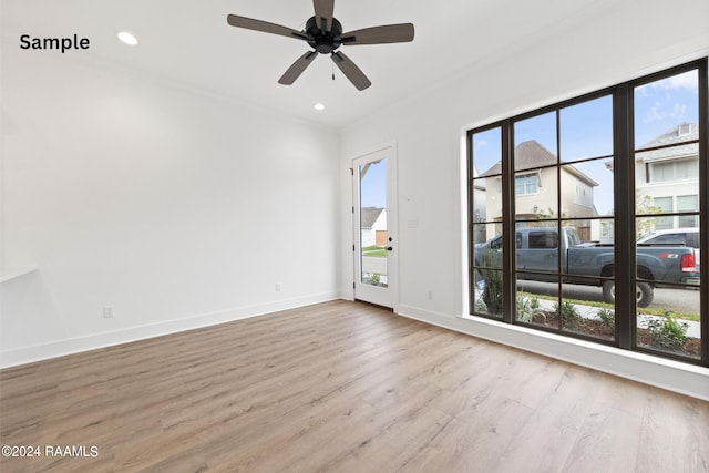 spare room with ceiling fan, light hardwood / wood-style flooring, plenty of natural light, and ornamental molding