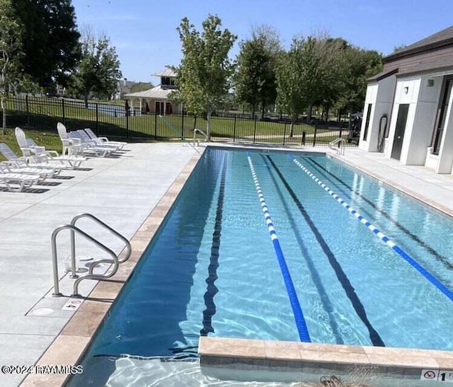 view of pool featuring a patio