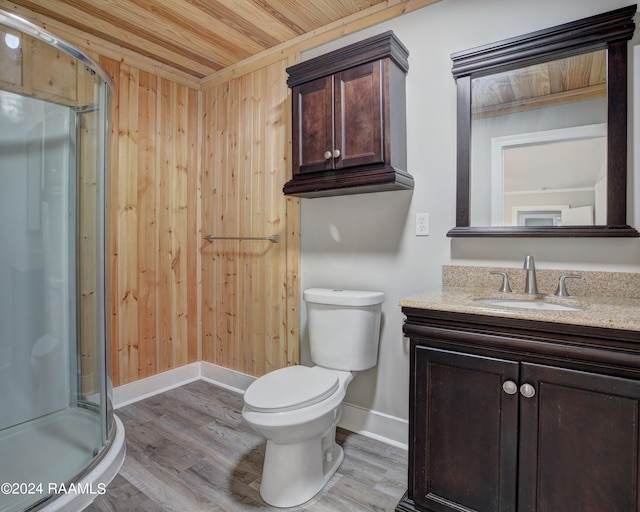 bathroom with a shower with door, wood-type flooring, wooden ceiling, and vanity