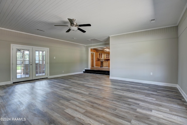 unfurnished living room with ceiling fan, french doors, ornamental molding, and wood-type flooring