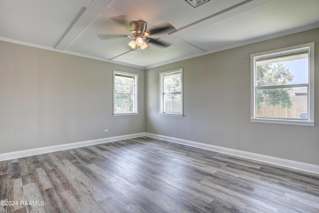 empty room with ornamental molding, ceiling fan, and light hardwood / wood-style floors