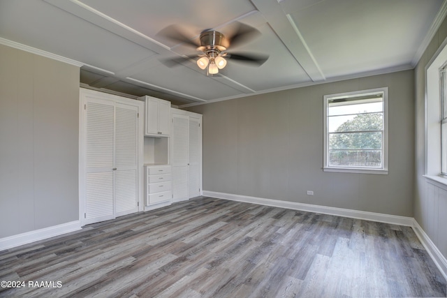 unfurnished bedroom with ornamental molding, ceiling fan, and light hardwood / wood-style flooring