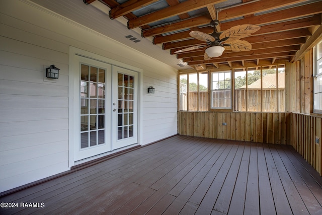 unfurnished sunroom with french doors, ceiling fan, and beam ceiling