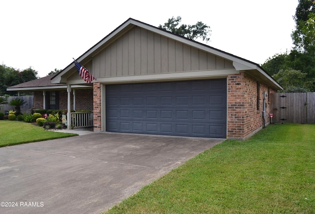 view of front of property with a garage and a front lawn