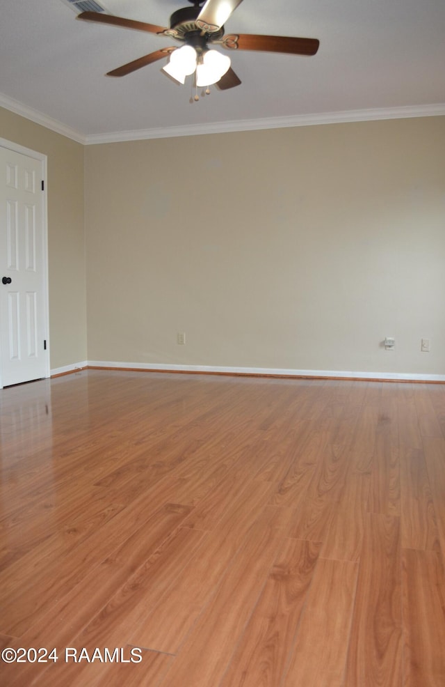 spare room featuring crown molding, ceiling fan, and hardwood / wood-style floors