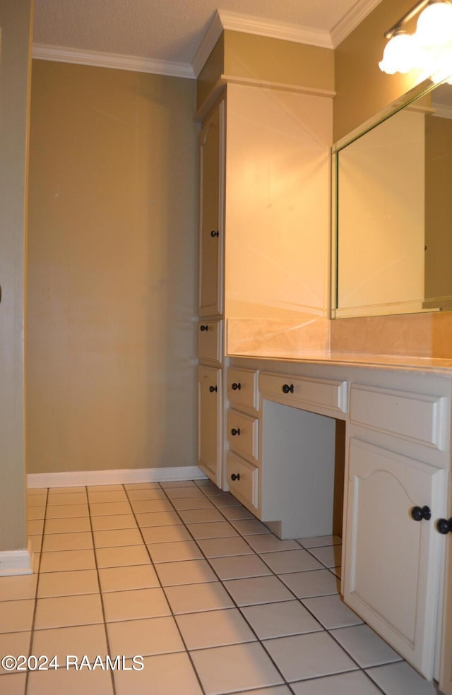 bathroom with ornamental molding and tile patterned flooring