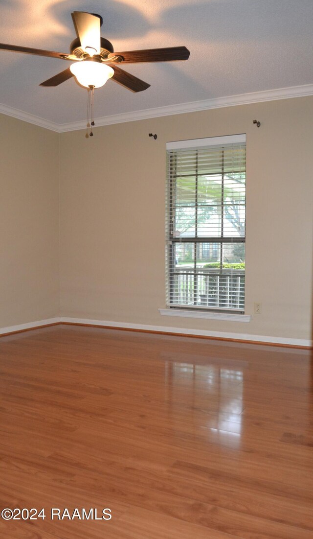 unfurnished room featuring crown molding, ceiling fan, and hardwood / wood-style floors