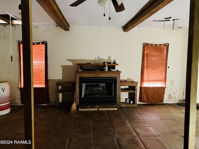 living room with beamed ceiling and ceiling fan