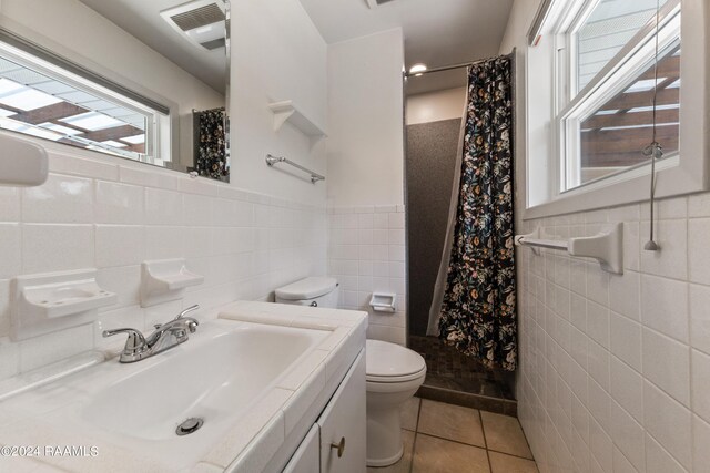 bathroom featuring tile walls and tile patterned flooring