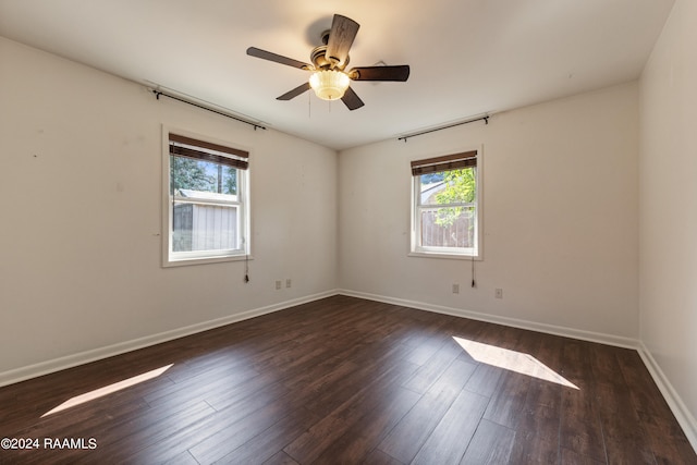 unfurnished room featuring ceiling fan and dark hardwood / wood-style floors