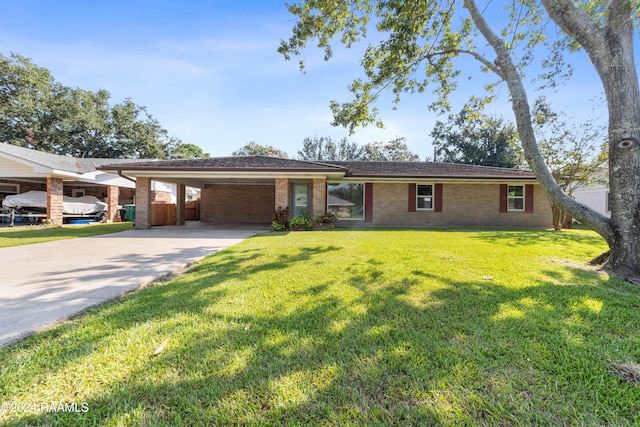 single story home with a front lawn and a carport