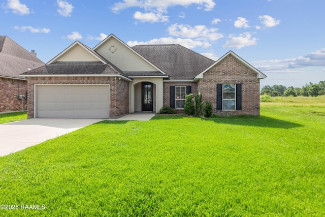 211 Vermont Dr, Carencro, LA 70520 - view of front of property with a front lawn, a garage, concrete driveway, brick siding, and a shingled roof