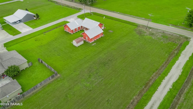 birds eye view of property featuring a rural view