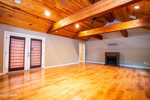 unfurnished living room featuring ceiling fan, wooden ceiling, hardwood / wood-style flooring, and lofted ceiling with beams