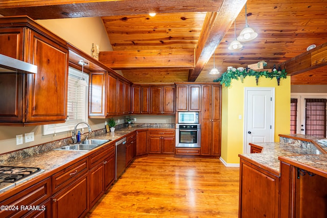 kitchen featuring a sink, appliances with stainless steel finishes, beamed ceiling, decorative light fixtures, and light wood-type flooring