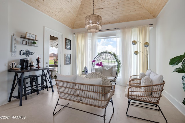 sitting room with high vaulted ceiling and wooden ceiling