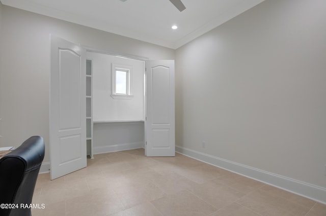 unfurnished office featuring ornamental molding and ceiling fan