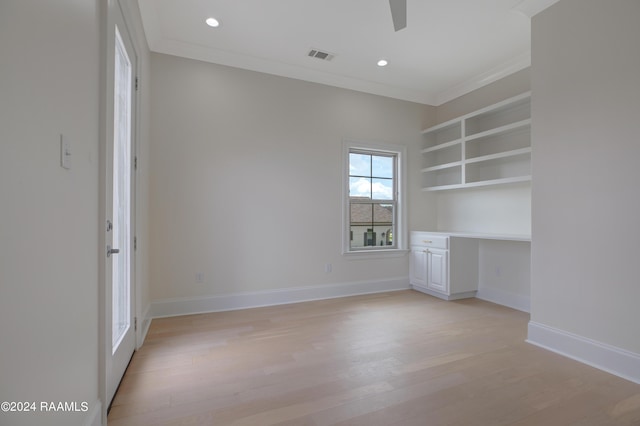 unfurnished bedroom with ornamental molding, light hardwood / wood-style floors, and ceiling fan