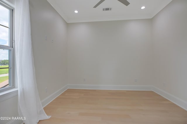 unfurnished room featuring ornamental molding, light hardwood / wood-style floors, and ceiling fan