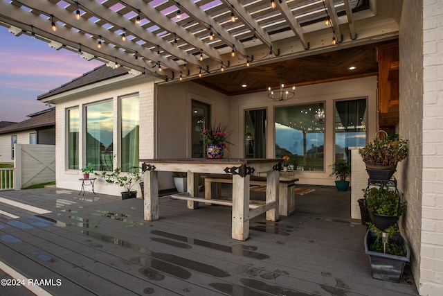 deck at dusk with a pergola