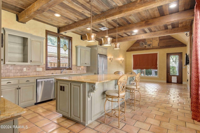 kitchen featuring appliances with stainless steel finishes, wood ceiling, plenty of natural light, and a kitchen island