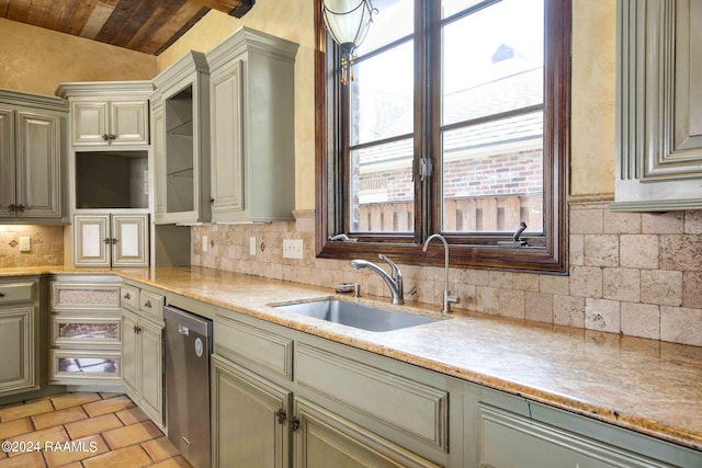 kitchen with wooden ceiling, stainless steel dishwasher, backsplash, light tile patterned floors, and sink