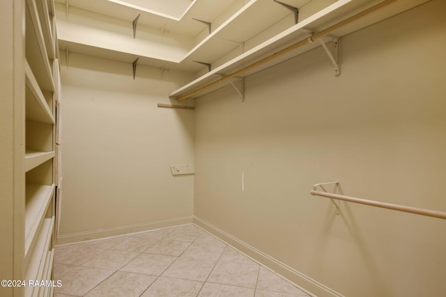 walk in closet featuring light tile patterned floors