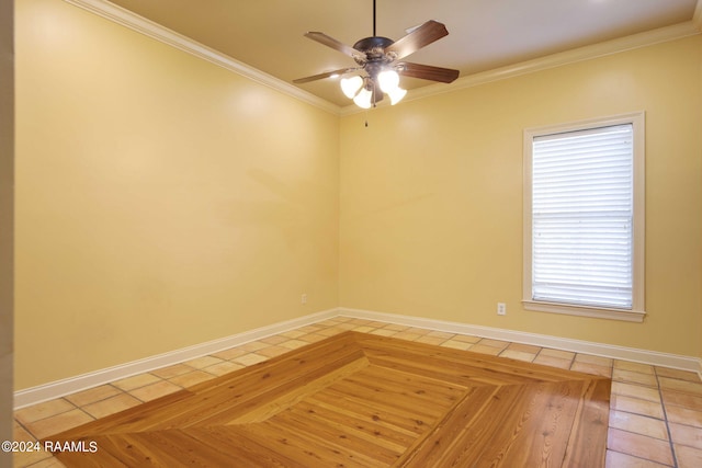 empty room with ornamental molding, light parquet floors, ceiling fan, and a wealth of natural light