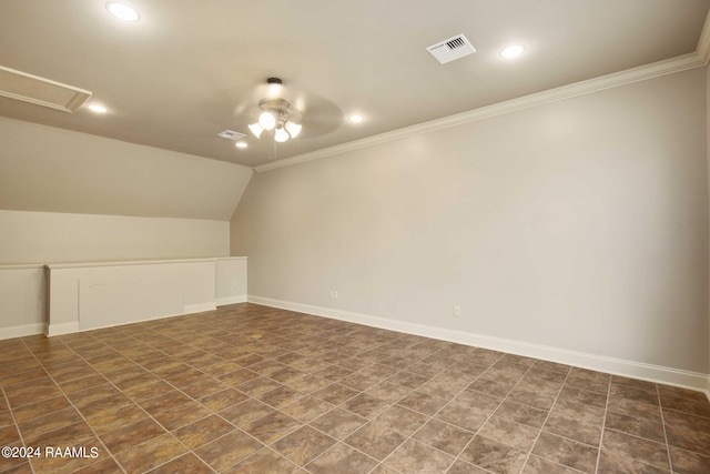 additional living space with lofted ceiling, baseboards, visible vents, and ceiling fan