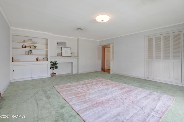 carpeted spare room with crown molding