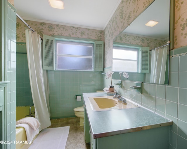 full bathroom featuring crown molding, vanity, and tile walls