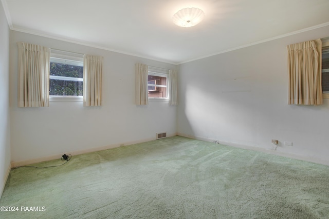 carpeted empty room with crown molding