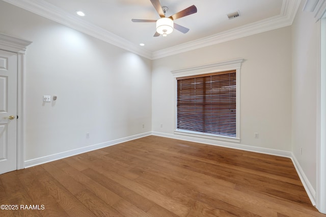 empty room with ornamental molding, wood-type flooring, and ceiling fan