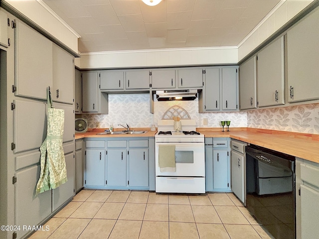 kitchen featuring dishwasher, wooden counters, sink, ventilation hood, and white range with gas stovetop