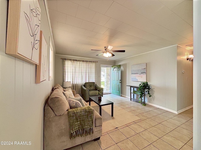 living room featuring light tile patterned floors, ceiling fan, and ornamental molding