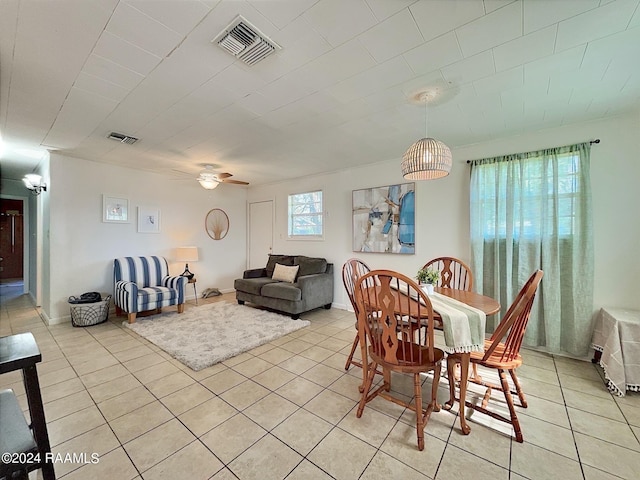 dining area with ceiling fan and light tile patterned floors