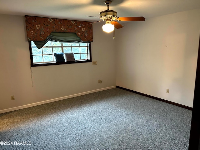 unfurnished room with carpet and ceiling fan