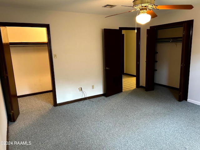 unfurnished bedroom featuring carpet and ceiling fan