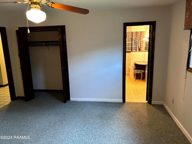 unfurnished bedroom featuring a closet and ceiling fan