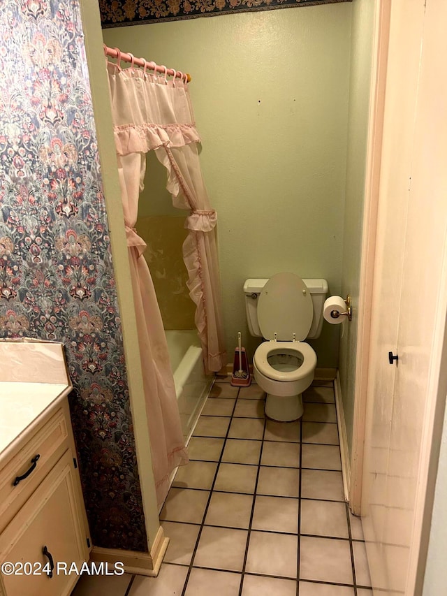 full bathroom featuring toilet, vanity, shower / bath combination with curtain, and tile patterned floors