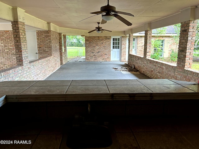 view of patio with ceiling fan