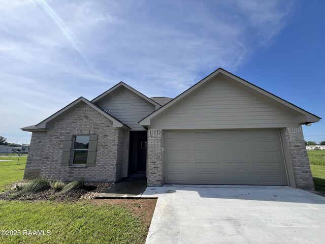 284 Sugarland Cir, Opelousas, LA 70570 - single story home with brick siding, concrete driveway, and an attached garage