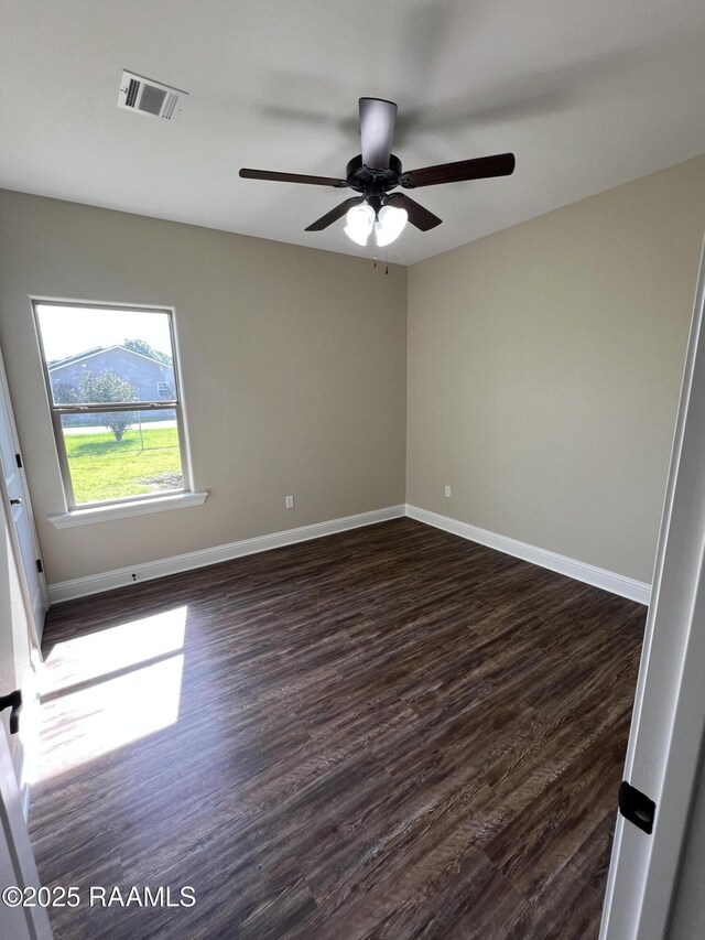284 Sugarland Cir, Opelousas, LA 70570 - unfurnished room with dark wood-style flooring, ceiling fan, and baseboards