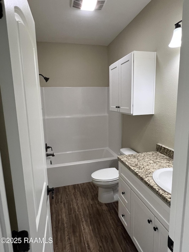 284 Sugarland Cir, Opelousas, LA 70570 - bathroom with wood finished floors, toilet, vanity, and shower / bath combination