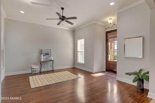 foyer entrance with crown molding, ceiling fan, and dark hardwood / wood-style flooring